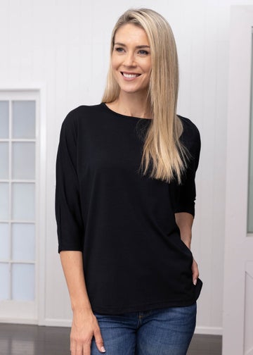 https://www.thewoolcompany.co.nz/content/products/merino-loose-34-sleeve-top-black-lifestyle-6217.jpg?width=360